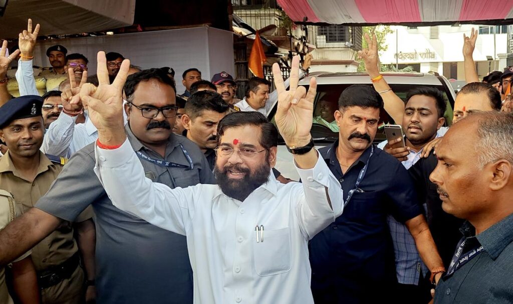 Eknath Shinde celebrates with supporters after the BJP-led alliance's victory in the 2024 Maharashtra Assembly elections